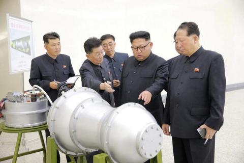 North Korean leader Kim Jong Un provides guidance with Ri Hong Sop (2nd L) and Hong Sung Mu (R) on a nuclear weapons program in this undated photo released by North Korea's Korean Central News Agency (KCNA) in Pyongyang, September 3, 2017. PHOTO BY REUTERS/KCNA