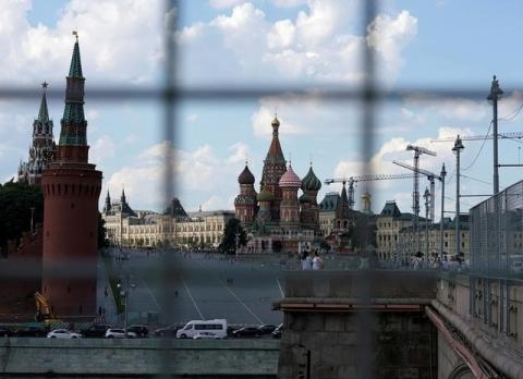A view through a construction fence shows the Kremlin towers and St. Basil's Cathedral on a hot summer day in central Moscow, Russia, July 1, 2016. PHOTO BY REUTERS/Maxim Zmeyev