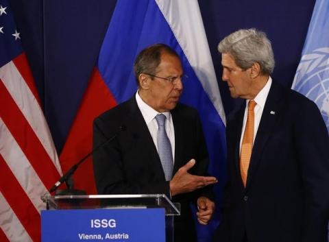 Russian Foreign Minister Sergei Lavrov (L) speaks to U.S. Secretary of State John Kerry before their news conference in Vienna, Austria, May 17, 2016. PHOTO BY REUTERS/Leonhard Foeger