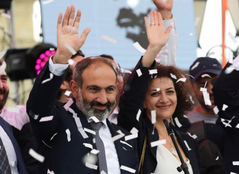 Newly elected Prime Minister of Armenia Nikol Pashinyan (L) greets supporters during a meeting in Republic Square in Yerevan, Armenia, May 8, 2018. PHOTO BY REUTERS/Hayk Baghdasaryan/Photolure