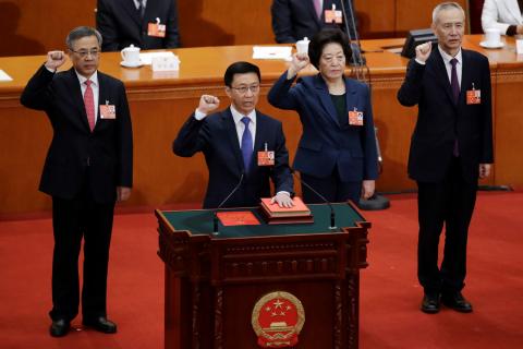 Newly elected Vice Premiers (L-R) Hu Chunhua, Han Zheng, Sun Chunlan and Liu He take an oath to the constitution at the seventh plenary session of the National People's Congress (NPC) at the Great Hall of the People in Beijing, China March 19, 2018. PHOTO BY REUTERS/Jason Lee