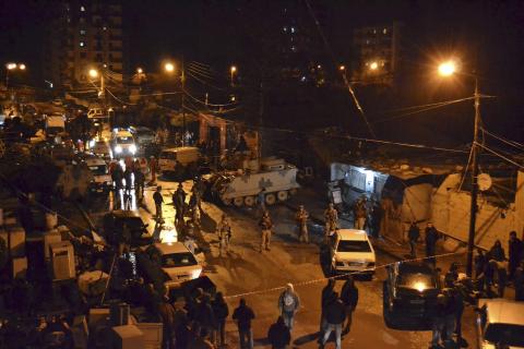 Lebanese Army soldiers man an area beside a cafe where a suicide bomb attack took place in Jabal Mohsen, Tripoli January 10, 2015. PHOTO BY REUTERS/Stringer