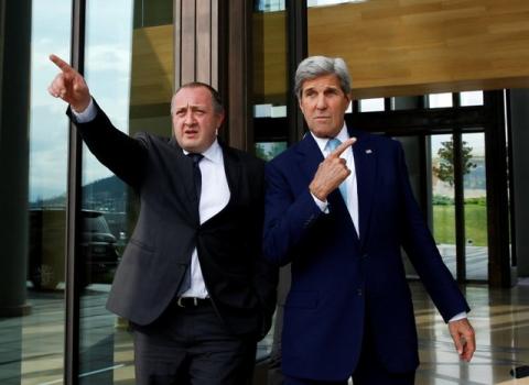U.S. Secretary of State John Kerry (R) and Georgia's President Georgy Margvelashvili walk out of a residence during a meeting in Tbilisi, Georgia, July 6, 2016. PHOTO BY REUTERS/David Mdzinarishvili