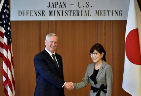 U.S. Defense Secretary Jim Mattis (L) shakes hands with Japan's Defense Minister Tomomi Inada during their meeting at the Defense Ministry in Tokyo, Japan, February 4, 2017. PHOTO BY REUTERS/Franck Robichon