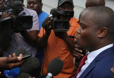Political activist and leader of the Tajamuka/Sesjikile Movement Promise Mkwananzi speaks to the media outside the Constitutional Court in Harare, Zimbabwe, February 8, 2017. PHOTO BY REUTERS/Philimon Bulawayo