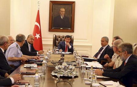 Turkey's Prime Minister Ahmet Davutoglu (C) chairs a security meeting in Ankara, Turkey, in this July 25, 2015 handout provided by Turkey's Prime Minister's Press Office. PHOTO BY REUTERS/Hakan Goktepe