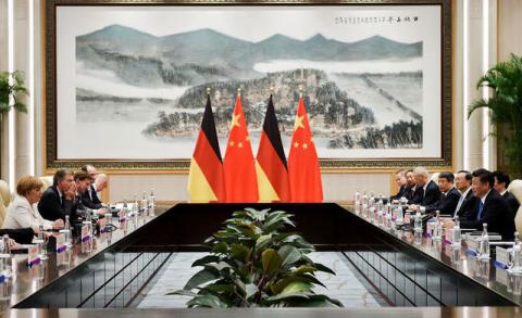 Chinese President Xi Jinping (R) and German Chancellor Angela Merkel (L) during their meeting at the West Lake State House on the sidelines of the G20 Summit, in Hangzhou, Zhejiang province, China, September 5, 2016. PHOTO BY REUTERS/Etienne Oliveau