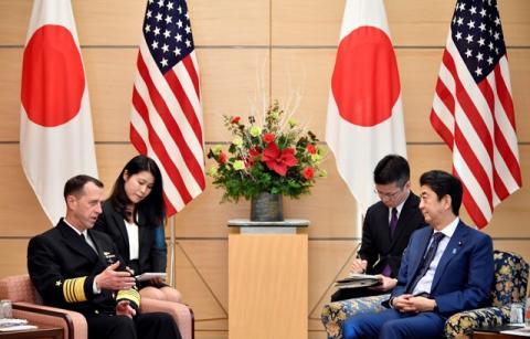Admiral John Richardson (L), Chief of U.S. Naval Operations, speaks to Japan's Prime Minister Shinzo Abe (R) at the start of their meeting at the Prime Minister's official residence in Tokyo, Japan, 18 December 2017. PHOTO BY REUTERS/Franck Robichon
