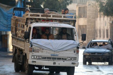 Men ride damaged vehicles with no windshields in a rebel-held besieged area in Aleppo, Syria, December 2, 2016. PHOTO BY REUTERS/Abdalrhman Ismail