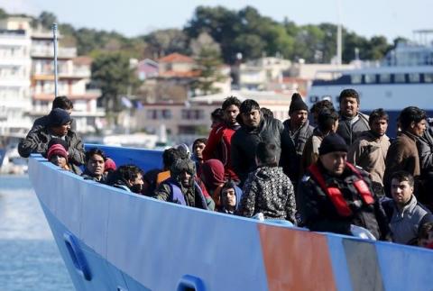 Migrants onboard an EU border agency Frontex boat arrive at the port city of Mytilene on Lesbos island, Greece, March 5, 2016. PHOTO BY REUTERS/Hannibal Hanschke