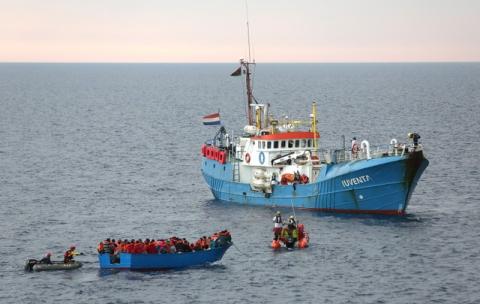 Migrants on a wooden boat are rescued by the crew of the German NGO Jugend Rettet ship "Juventa" in the Mediterranean sea off the Libyan coast, June 18, 2017. PHOTO BY REUTERS/Stefano Rellandini