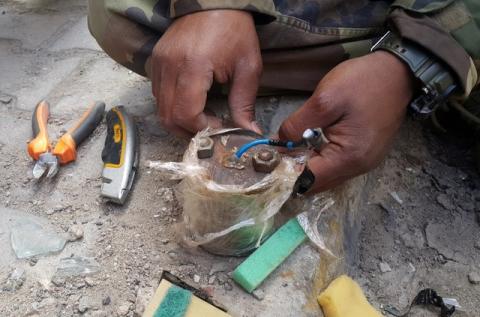 A member of the demining team of the Libyan National Army dismantles a mine in Benghazi, Libya, January 14, 2018. PHOTO BY REUTERS/Ayman Alwrfaly