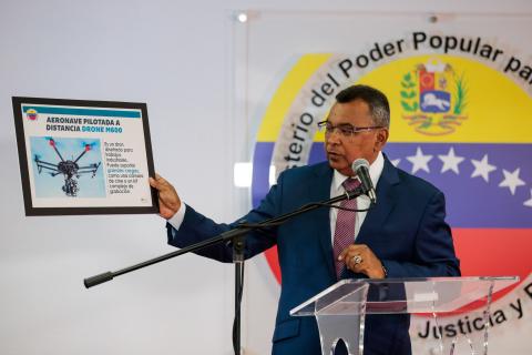 Venezuela's Interior and Justice Minister Nestor Reverol holds a placard with a picture of a drone during a news conference in Caracas, Venezuela, August 5, 2018. PHOTO BY REUTERS/Ministry of Interior and Justice