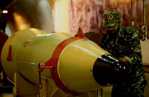 A member of the Iranian Revolutionary Guards checks a missile inside an underground depot in an undisclosed location, Iran, in this handout photo released by the official website of Islamic Revolutionary Guard Corps (IRGC) on March 8, 2016. PHOTO BY REUTERS/sepahnews.com