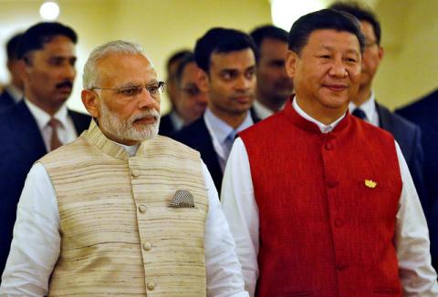 Indian Prime Minister Narendra Modi (L) and Chinese President Xi Jinping arrive for a photo opportunity ahead of BRICS (Brazil, Russia, India, China and South Africa) Summit in Benaulim, in the western state of Goa, India, October 15, 2016. PHOTO BY REUTERS/Danish Siddiqui