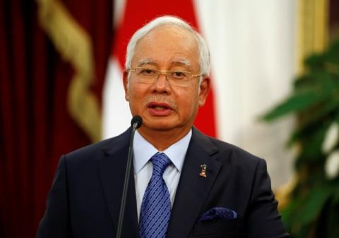 Malaysia's Prime Minister Najib Razak talks to the media beside Indonesia's President Joko Widodo after a bilateral meeting at Presidential Palace in Jakarta, Indonesia, August 1, 2016. PHOTO BY REUTERS/Beawiharta