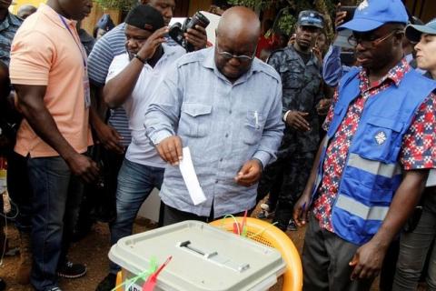 Ghanaian Presidential candidate Nana Akufo-Addo (C) of the opposition New Patriotic Party (NPP) casts his vote at a polling station in Kibi, eastern region of Ghana, December 7, 2016. PHOTO BY REUTERS/Luc Gnago
