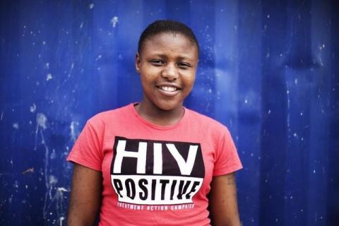 Nandi Makhele, poses for a portrait while wearing a T-shirt indicating that she is HIV-positive, in Cape Town's Khayelitsha township. PHOTO BY REUTERS/Finbarr O'Reilly