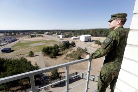 Lithuanian army officer Nerijus Rocevicius looks at construction site of the newly built training premises for urban warfare in Pabrade, Lithuania, April 28, 2016. PHOTO BY REUTERS/Ints Kalnins