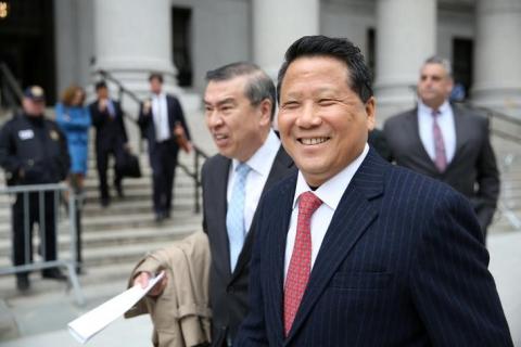 Macau billionaire real estate developer Ng Lap Seng (R), accused of bribing former United Nations General Assembly president John Ashe, exits the Manhattan U.S. District Courthouse in New York, U.S., April 7, 2017. PHOTO BY REUTERS/Ashlee Espinal