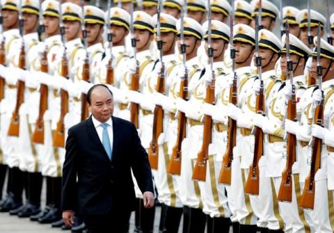 Vietnam's Prime Minister Nguyen Xuan Phuc reviews navy soldiers' honour guard during a welcoming ceremony at the Great Hall of the People in Beijing, China, September 12, 2016. PHOTO BY REUTERS/Jason Lee