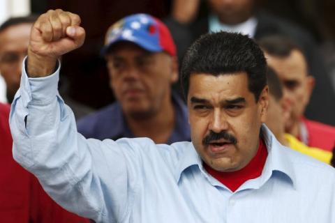 Venezuela's President Nicolas Maduro gestures while he attends a rally against the opposition's amnesty law at Miraflores Palace in Caracas, April 7, 2016. PHOTO BY REUTERS/Carlos Garcia Rawlins