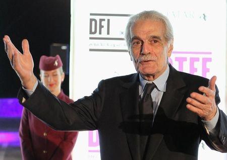 Egyptian veteran actor Omar al-Sharif poses on the red carpet as he arrives at the opening of the 2011 Doha Tribeca Film Festival in Doha, October 25, 2011. PHOTO BY REUTERS/Mohammed Dabbous