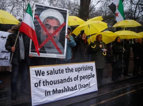 Opponents of Iranian President Hassan Rouhani hold a protest outside the Iranian embassy in west London, December 31, 2017. REUTERS/Eddie Keogh