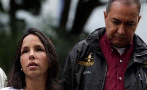 Oriette Schadendorf Capriles, stepdaughter of opposition leader Antonio Ledezma, is accompanied by lawmaker Richard Blanco as she talks to reporters outside their home in Caracas, Venezuela, August 4, 2017. PHOTO BY REUTERS/Marco Bello