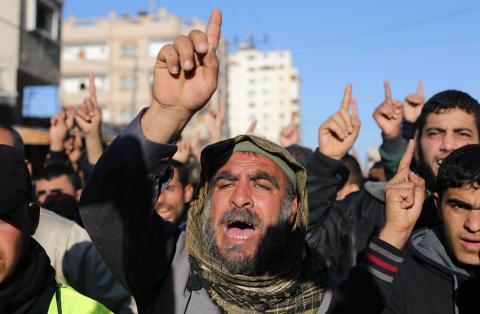 Palestinians chant slogans during a protest against the decision of an Egyptian court to list Hamas's armed wing as a terrorist organization, in Rafah near the border between southern Gaza Strip and Egypt, February 5, 2015. PHOTO BY REUTERS/Ibraheem Abu Mustafa