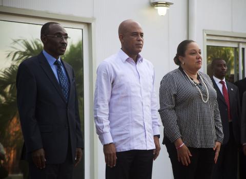 Haiti's Prime Minister Evans Paul, Haiti's President Michel Martelly and Martelly's wife Sophia (L-R) stand together during a ceremony in Port-au-Prince, January 19, 2015. PHOTO BY REUTERS/Jeanty Junior Augustin