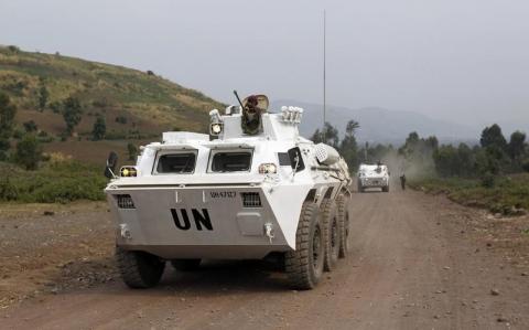 U.N. peacekeepers drive in their armoured personnel carrier (APC) as they patrol the road towards Kibati, outside Goma in the eastern Democratic Republic of Congo, August 30, 2013. PHOTO BY REUTERS/Thomas Mukoy