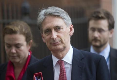 Britain's Foreign Secretary Philip Hammond leaves Downing Street after a meeting in London, October 16, 2014. PHOTO BY REUTERS/Neil Hall