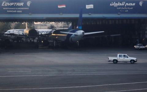 An EgyptAir maintenance and engineering hangar is pictured through the window of a plane in Cairo International Airport, Egypt, December 16, 2017. PHOTO BY REUTERS/Amr Abdallah Dalsh
