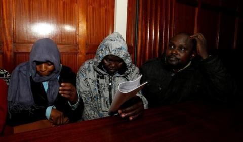 Kenyan police officers Silvia Wanjohi, Stephen Morogo and Fredrick Leliman, suspected of killing human rights lawyer Willie Kimani, his client and their driver, sit in the dock at Milimani Law courts in Nairobi, Kenya, July 4, 2016. PHOTO BY REUTERS/Thomas Mukoya
