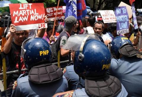 Anti-riot police officers block activists as they protest against the declaration of martial law in Mindanao, southern Philippines, during a rally in front of the Supreme Court in Metro Manila, Philippines July 4, 2017. PHOTO BY REUTERS/Dondi Tawatao