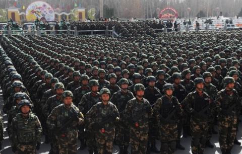 Paramilitary policemen stand in formation as they take part in an anti-terrorism oath-taking rally, in Kashgar, Xinjiang Uighur Autonomous Region, China, February 27, 2017. PHOTO BY REUTERS/Stringer