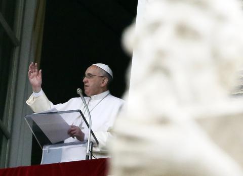 Pope Francis waves during his Sunday Angelus prayer in Saint Peter's Square at the Vatican, January 11, 2015. PHOTO BY REUTERS/Stefano Rellandini