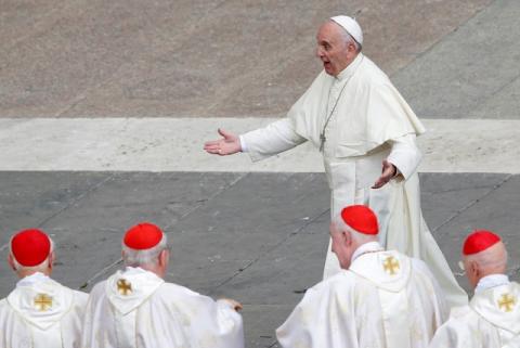 Pope Francis reacts as he is greeted by Cardinals at the end of a mass for the Jubilee of Priests at St. Peter's Square at the Vatican, June 3, 2016. PHOTO BY REUTERS/Alessandro Bianchi
