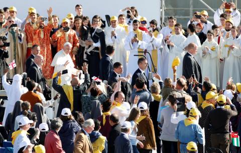 Pope Francis waves as he arrives for a holy mass at Mikheil Meskhi stadium in Tbilisi, Georgia, October 1, 2016. PHOTO BY REUTERS/David Mdzinarishvili