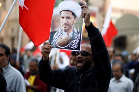 A protester holding a portrait of Ali Salman, the head of Bahrain's main opposition party Al Wefaq, shout anti-government slogans during a protest demanding Salman's release in the village of Bilad Al Qadeem south of Manama, January 12, 2015. PHOTO BY REUTERS/Hamad I Mohammed