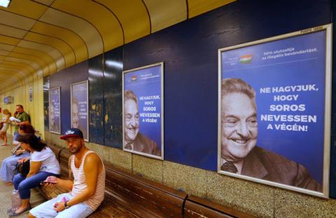 Hungarian government poster portraying financier George Soros and saying "Don't let George Soros have the last laugh" is seen at an underground stop in Budapest, Hungary, July 11, 2017. PHOTO BY REUTERS/Laszlo Balogh