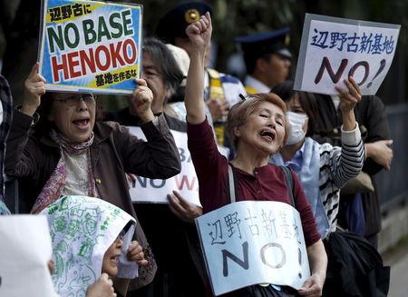 People protesting the planned relocation of the U.S. military base, to Okinawa's Henoko coast, shout slogans at a rally in front of Prime Minister Shinzo Abe's official residence, as a meeting between Okinawa Governor Takeshi Onaga and Abe is holding, in Tokyo, April 17, 2015. PHOTO BY REUTERS/Issei Kato