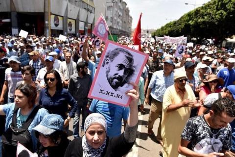 A protester holds a portrait of protest movement leader Nasser Zefzafi and shouts slogans during a demonstration against corruption and official abuses, in the Rif region in Rabat, Morocco, June 11, 2017. PHOTO BY REUTERS/Stringer