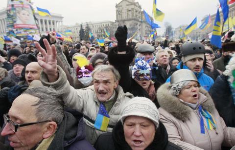 Pro-European protesters shout slogans and gesture during a rally at Independence Square in Kiev