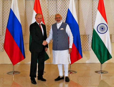 Russian President Vladimir Putin (L) shakes hand with India's Prime Minister Narendra Modi during a photo opportunity ahead of India-Russia Annual Summit in Benaulim, in the western state of Goa, India, October 15, 2016. PHOTO BY REUTERS/Danish Siddiqui