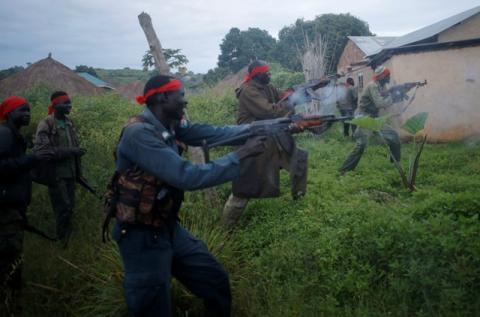 SPLA-IO (SPLA-In Opposition) rebels fire weapons during an assault on government SPLA (Sudan People's Liberation Army) soldiers in the town of Kaya, on the border with Uganda, South Sudan, August 26, 2017. PHOTO BY REUTERS/Goran Tomasevic
