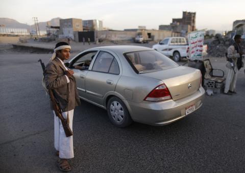 Shi'ite Houthi rebels man a checkpoint in Sanaa