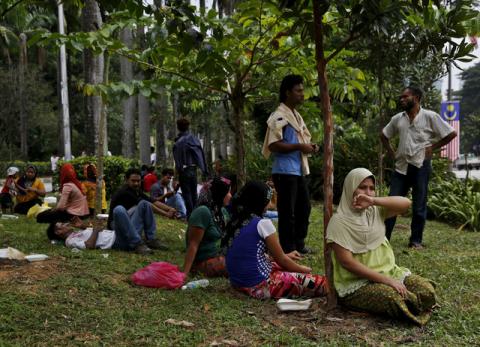 Refugees, many of whom say they are Rohingya, wait for access to the United Nations High Commission for Refugees (UNHCR) building in Kuala Lumpur, Malaysia, August 11, 2015. PHOTO BY REUTERS/Olivia Harris