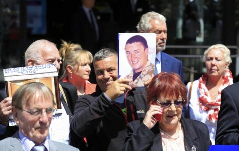 Relatives of British soldiers killed in Iraq stand outside the Queen Elizabeth II centre, after the publication of The Iraq Inquiry Report, in London, Britain, July 6, 2016. PHOTO BY REUTERS/Paul Hackett